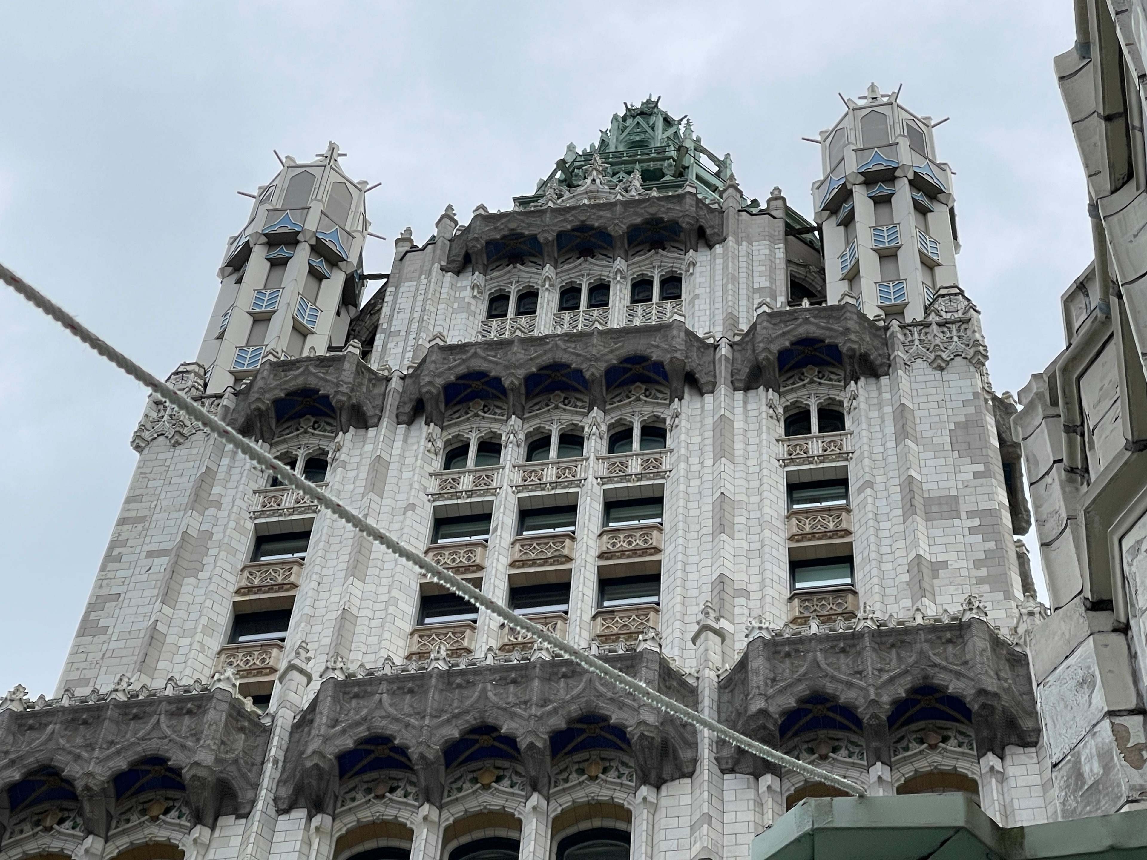 Woolworth Building upper tower, ornamental balconies and pinnacles viewed from scaffold level