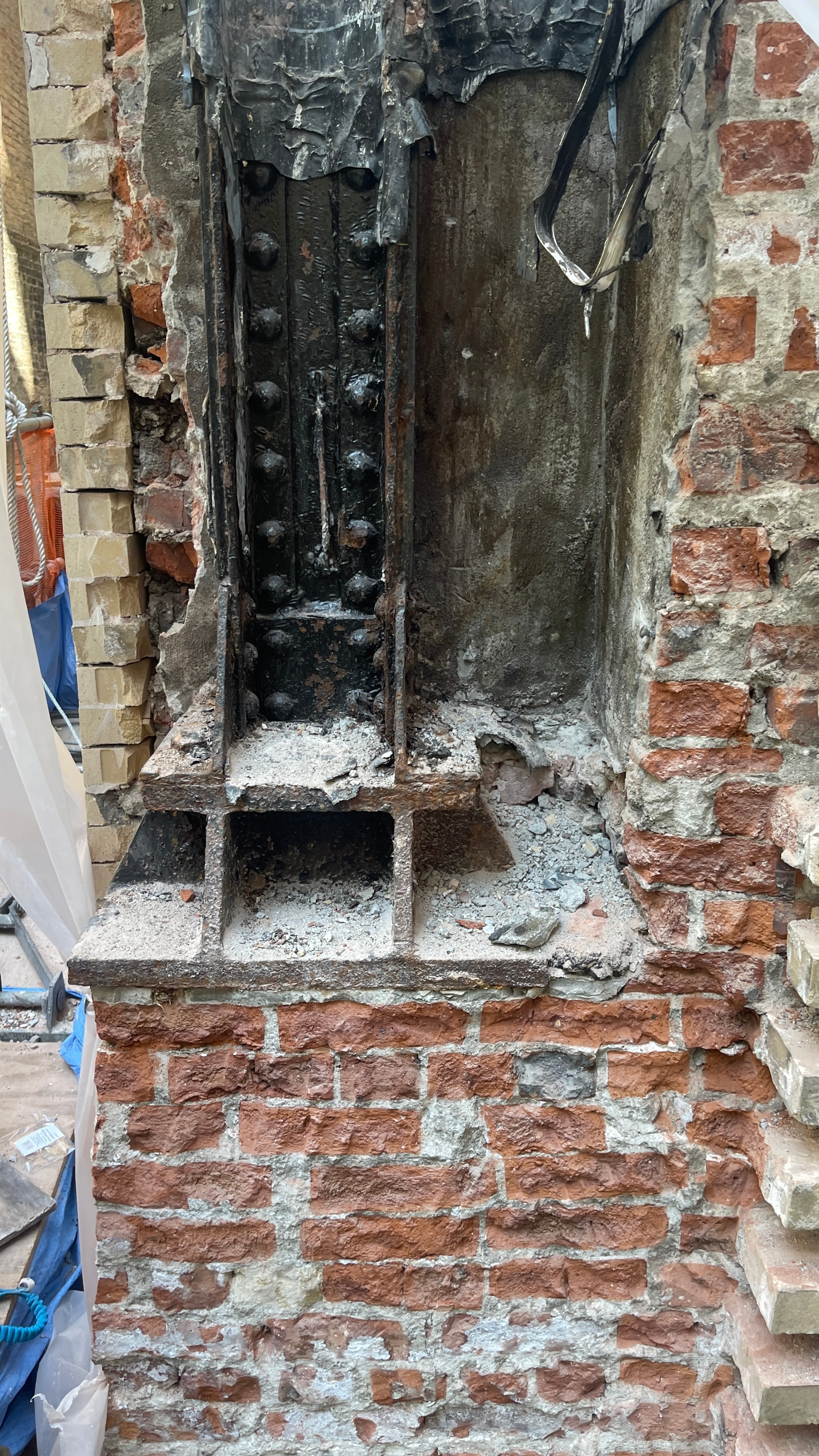 Exposed brick masonry and steel during construction