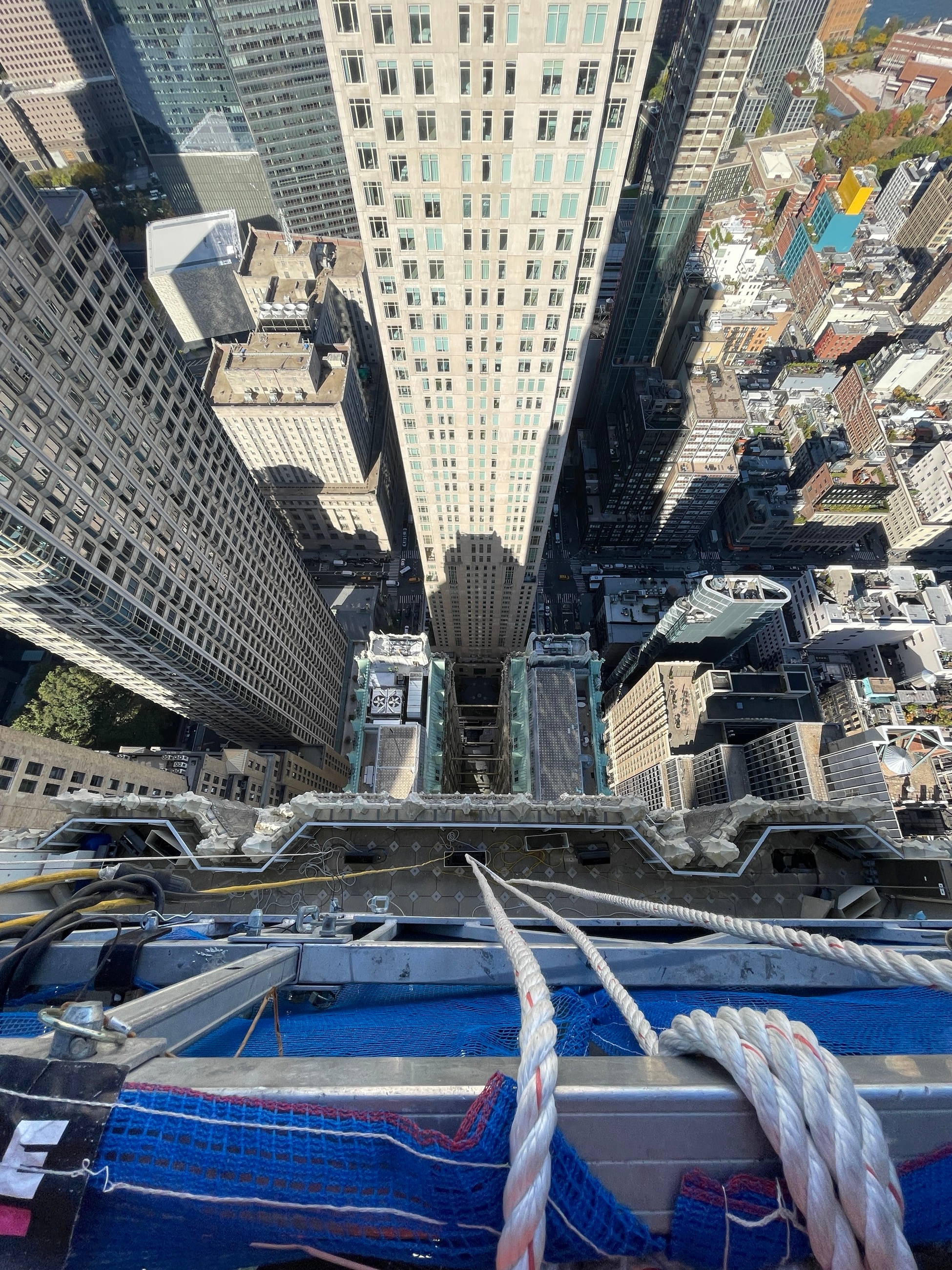 Suspended access above Lower Manhattan during facade rehabilitation